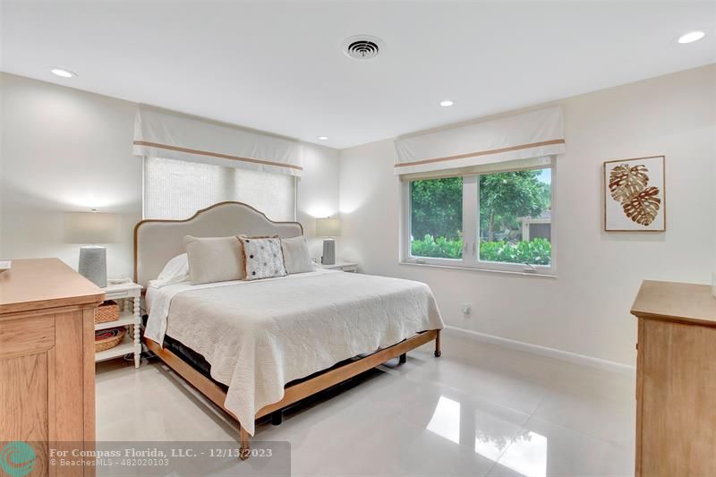 1985 Sailfish Place Pompano Beach, FL 33062 - Photo 29 of 47 a bedroom with a bed and window