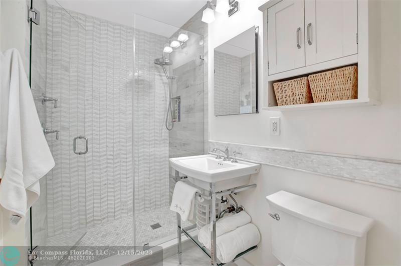 1985 Sailfish Place Pompano Beach, FL 33062 - Photo 30 of 47 a bathroom with a sink a toilet and shower