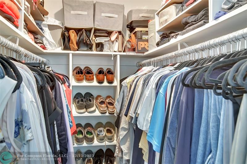 1985 Sailfish Place Pompano Beach, FL 33062 - Photo 31 of 47 a view of walk in closet with clothes and shoes