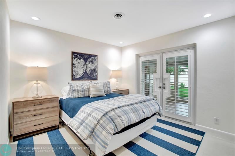 1985 Sailfish Place Pompano Beach, FL 33062 - Photo 38 of 47 a bedroom with a bed and a dresser