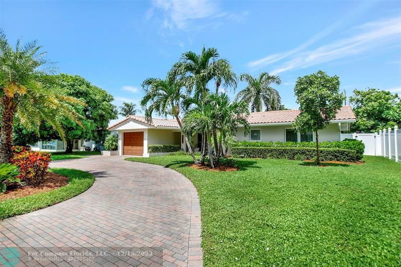 1985 Sailfish Place Pompano Beach, FL 33062 - Photo 4 of 47 a front view of a house with a garden