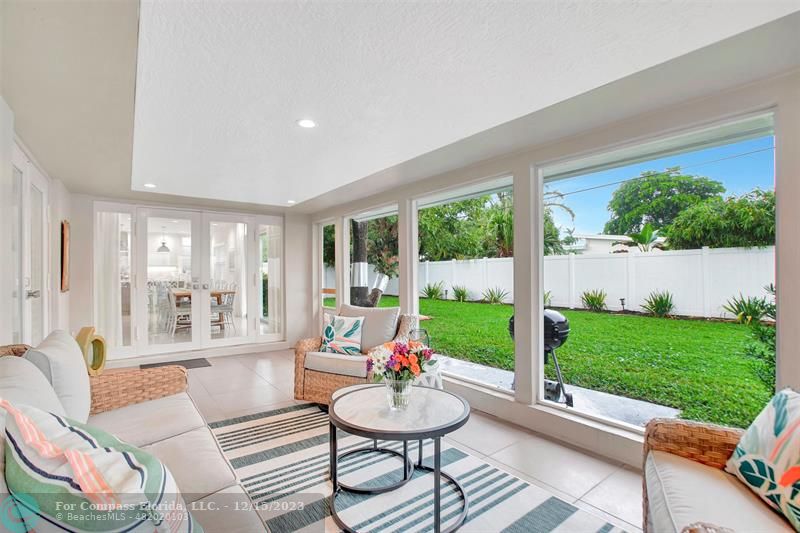 1985 Sailfish Place Pompano Beach, FL 33062 - Photo 43 of 47 a living room with patio furniture and a large window