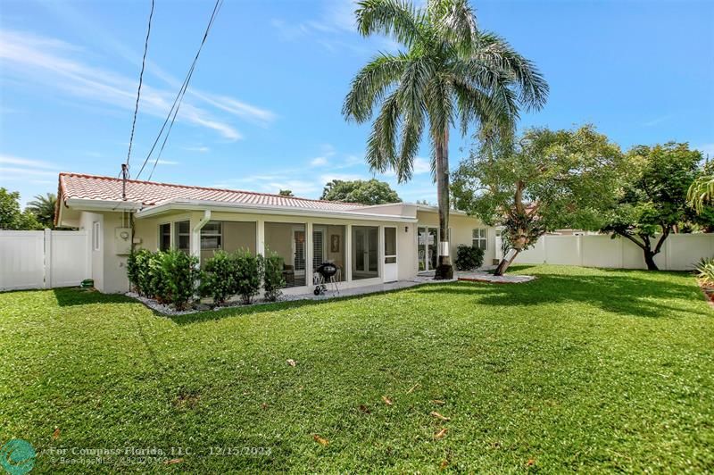 1985 Sailfish Place Pompano Beach, FL 33062 - Photo 5 of 47 a front view of house with yard and outdoor seating