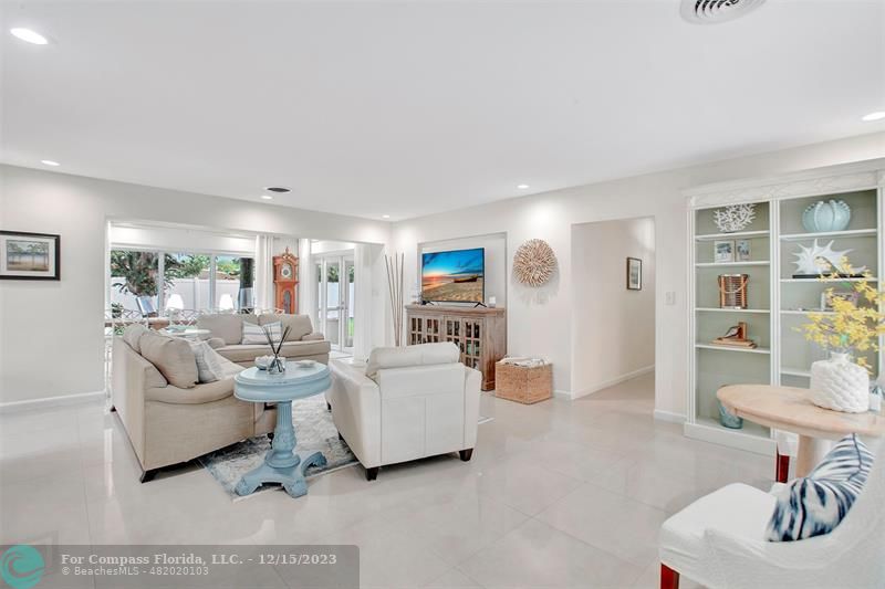 1985 Sailfish Place Pompano Beach, FL 33062 - Photo 6 of 47 a living room with furniture and a wooden floor