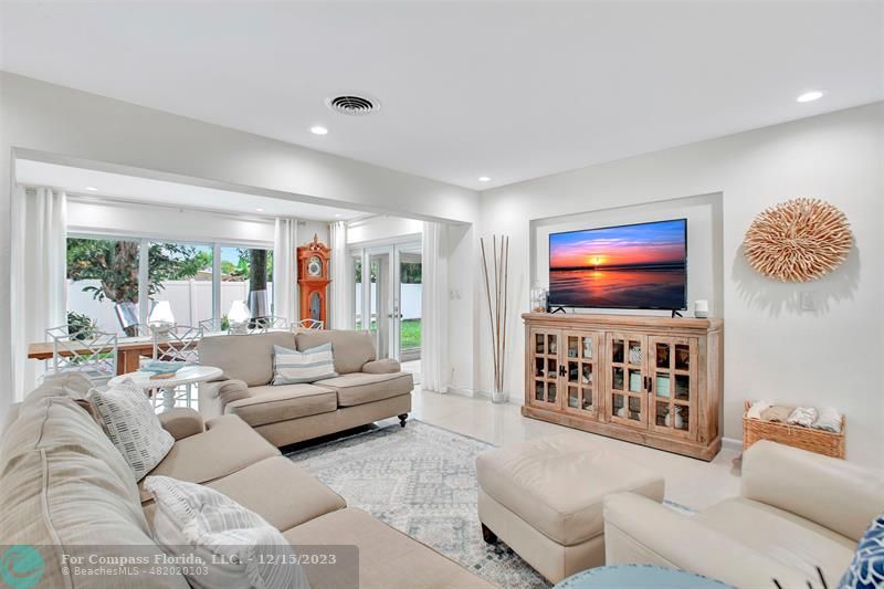1985 Sailfish Place Pompano Beach, FL 33062 - Photo 7 of 47 a living room with furniture and a flat screen tv