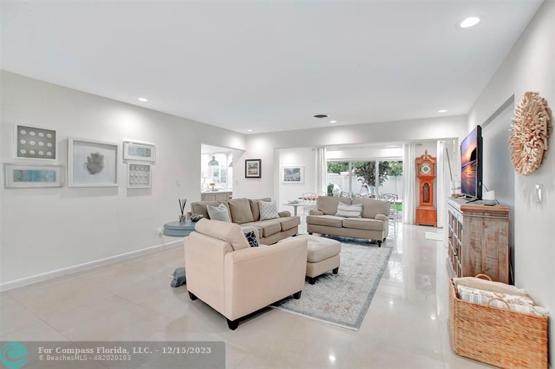 1985 Sailfish Place Pompano Beach, FL 33062 - Photo 8 of 47 a living room with furniture and a flat screen tv