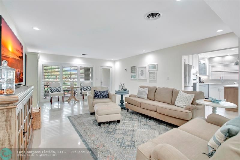 1985 Sailfish Place Pompano Beach, FL 33062 - Photo 10 of 47 a living room with furniture and a large window