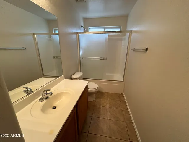 a bathroom with a sink and shower
