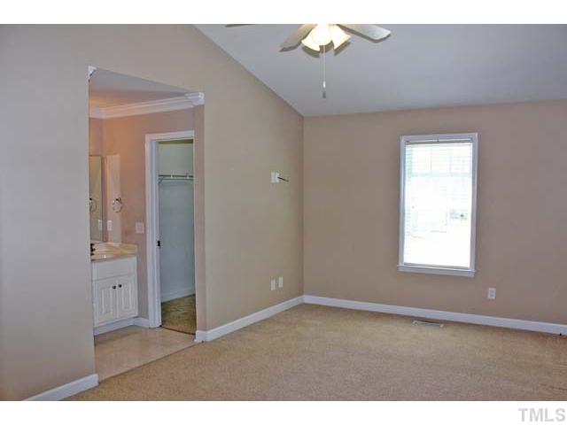 462 Axum Road Willow Spring, NC 27592 - Photo 9 of 18 a view of an empty room with a window