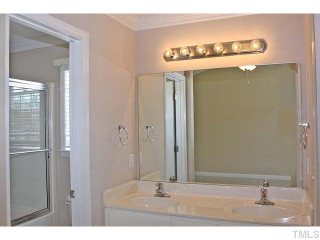 462 Axum Road Willow Spring, NC 27592 - Photo 10 of 18 a picture of a bathroom with mirror