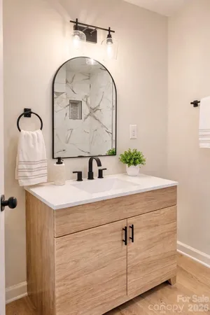 a bathroom with a sink and a mirror