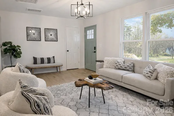 a living room with furniture and a large window