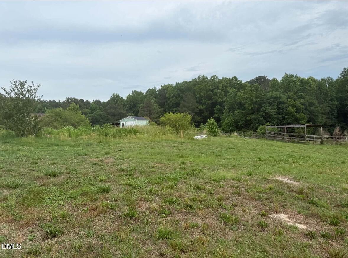 344 J B Leonard Road Castalia, NC 27816 - Photo 20 of 32 a view of a field with an trees in the background
