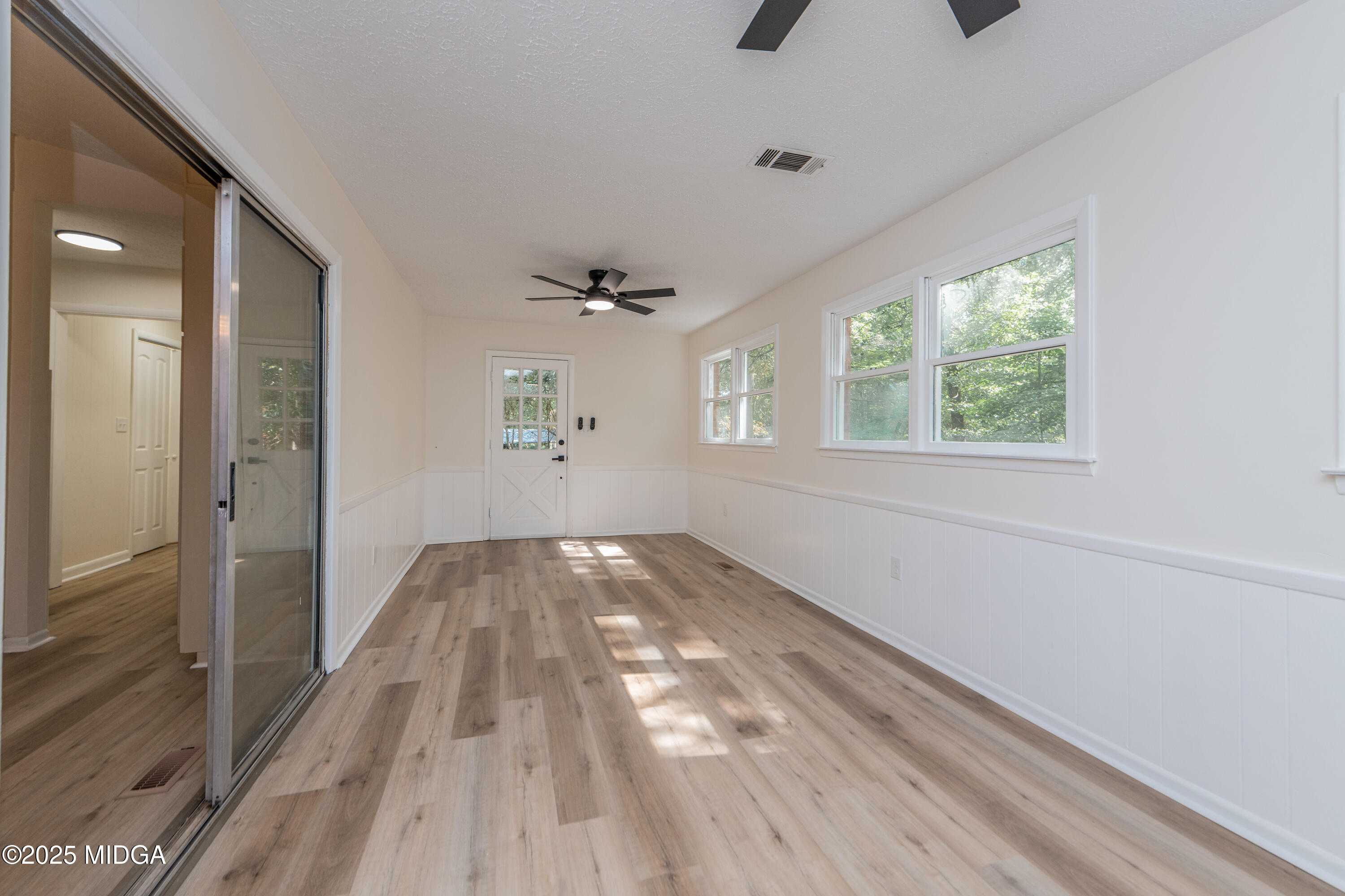 139 Old Oak Road Byron, GA 31008 - Photo 22 of 59 a view of empty room with wooden floor and fan
