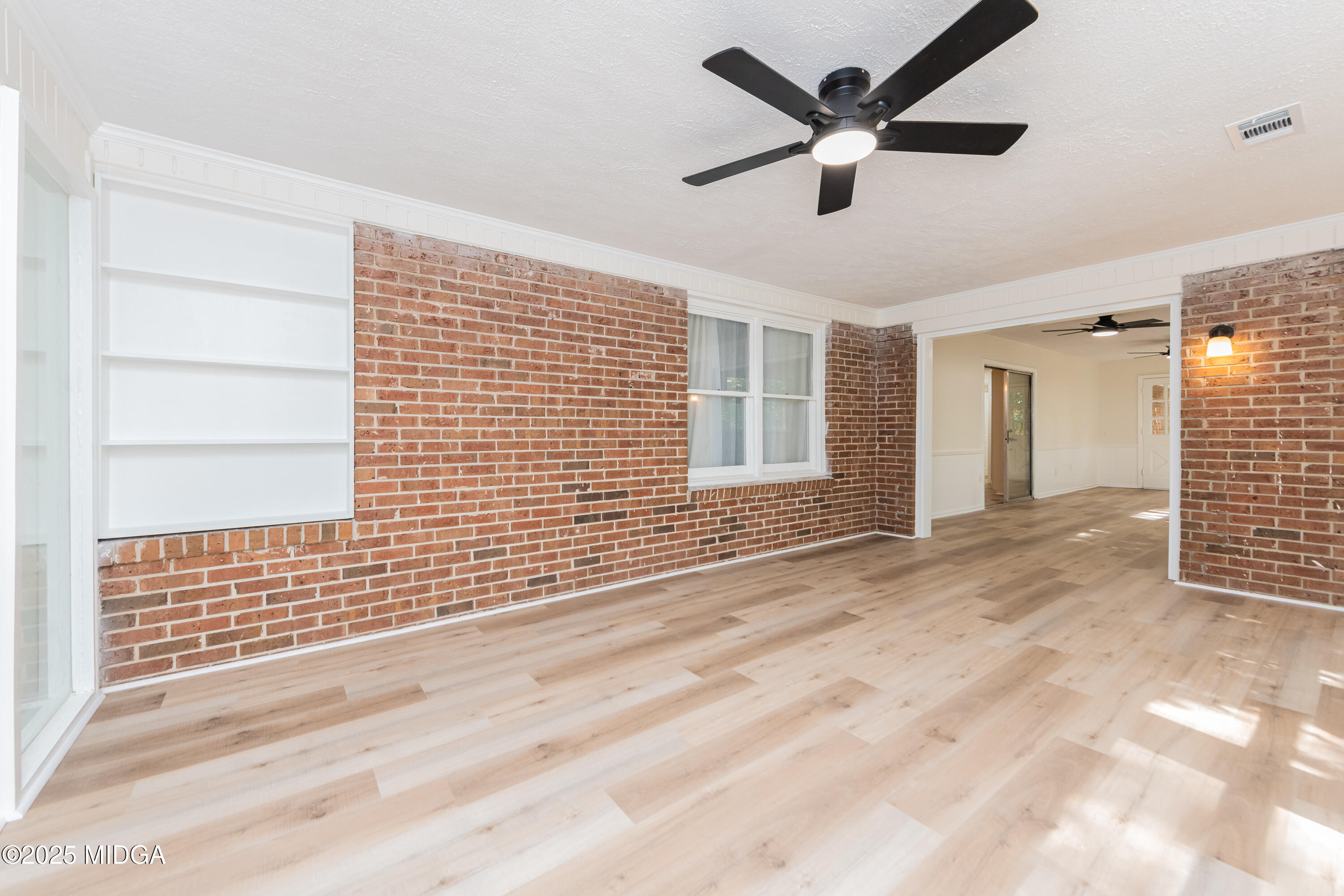 139 Old Oak Road Byron, GA 31008 - Photo 48 of 59 a view of an empty room with a ceiling fan and window