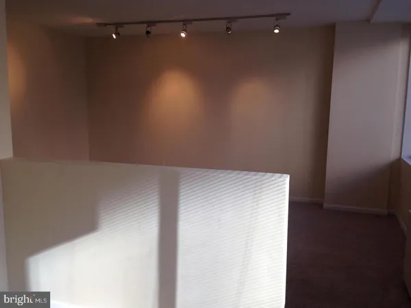 an empty room with wooden floor