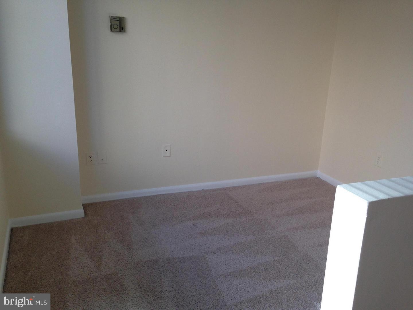 522 21st Street Northwest, Unit 307 Washington, DC 20006 - Photo 4 of 8 an empty room with wooden floor