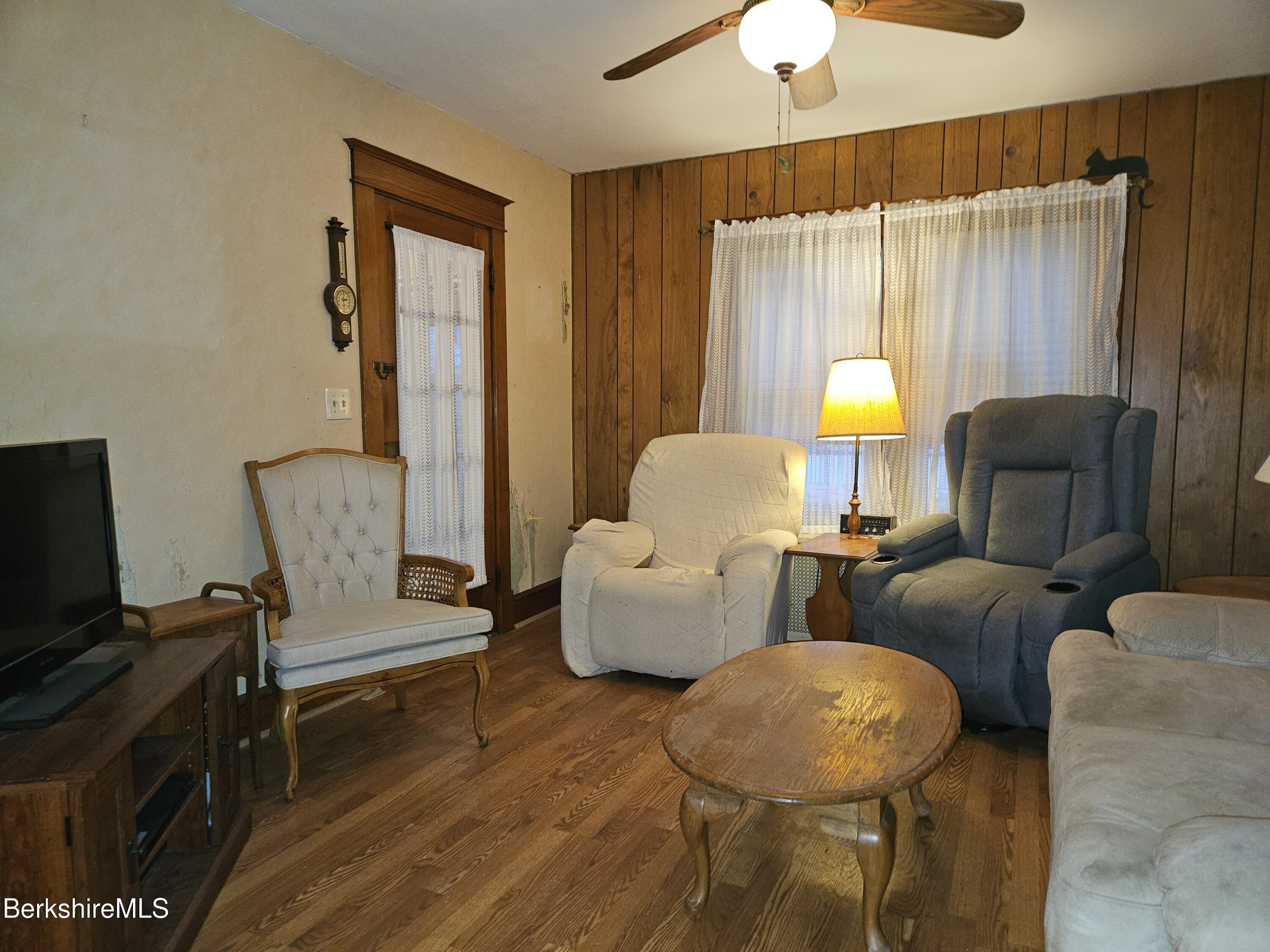 269 2nd Street Pittsfield, MA 01201 - Photo 8 of 39 a living room with furniture and a flat screen tv