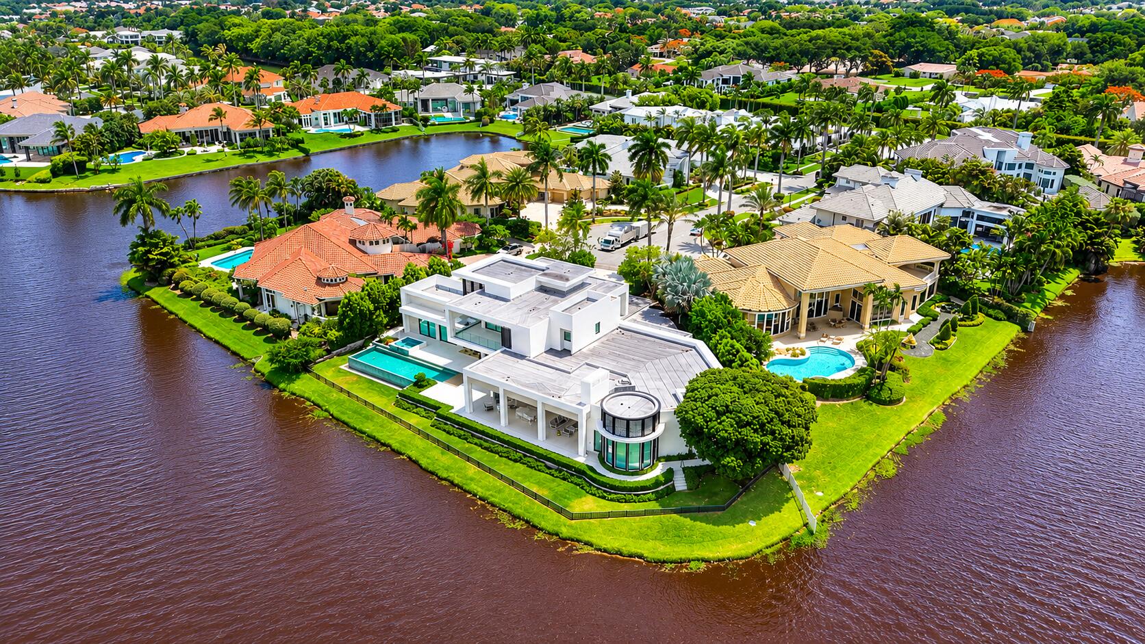6960 Lake Estates Court Boca Raton, FL 33496 - Photo 57 of 58 an aerial view of a house with a garden and lake view