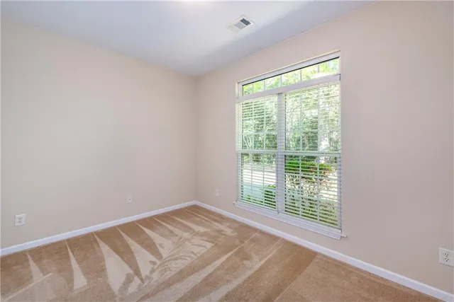 a view of a room that has a window in it