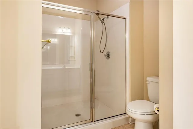 a bathroom with a glass shower door