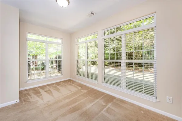 a view of a room with large windows