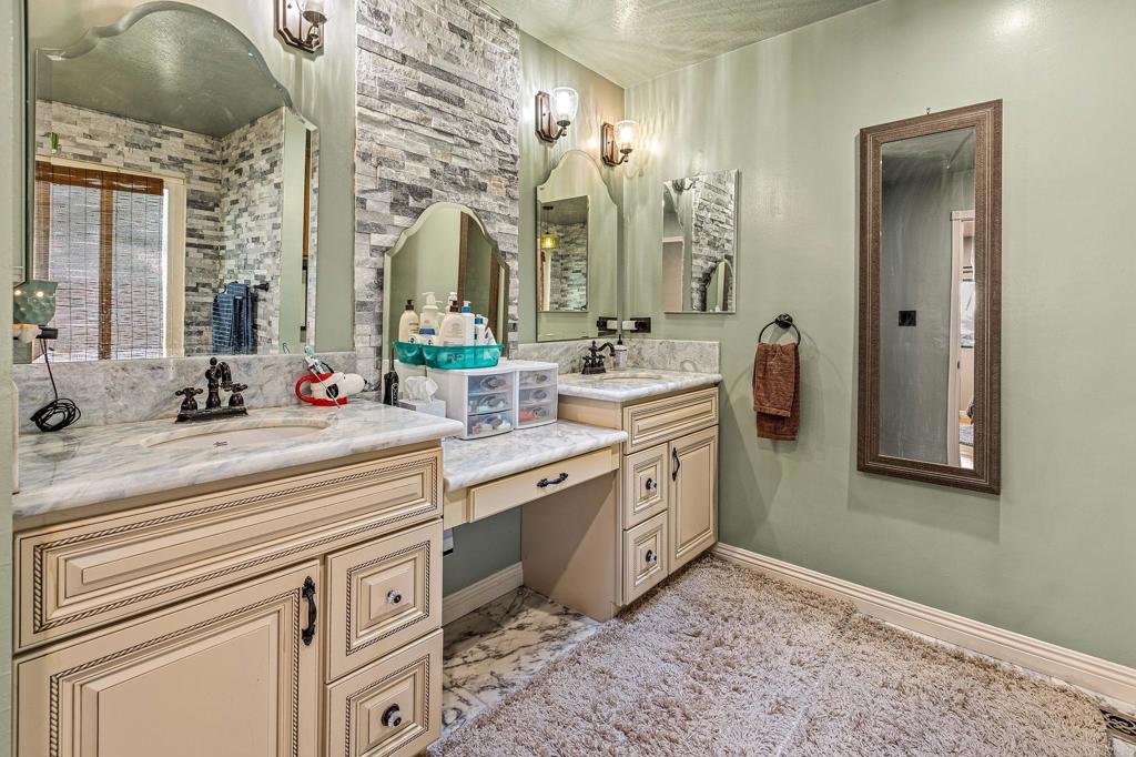 8411 Foothill Boulevard Pine Valley, CA 91962 - Photo 18 of 46 a spacious bathroom with a double vanity sink and a mirror