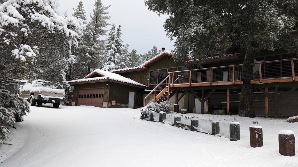 8411 Foothill Boulevard Pine Valley, CA 91962 - Photo 39 of 46 a wooden bench sitting in front of a house