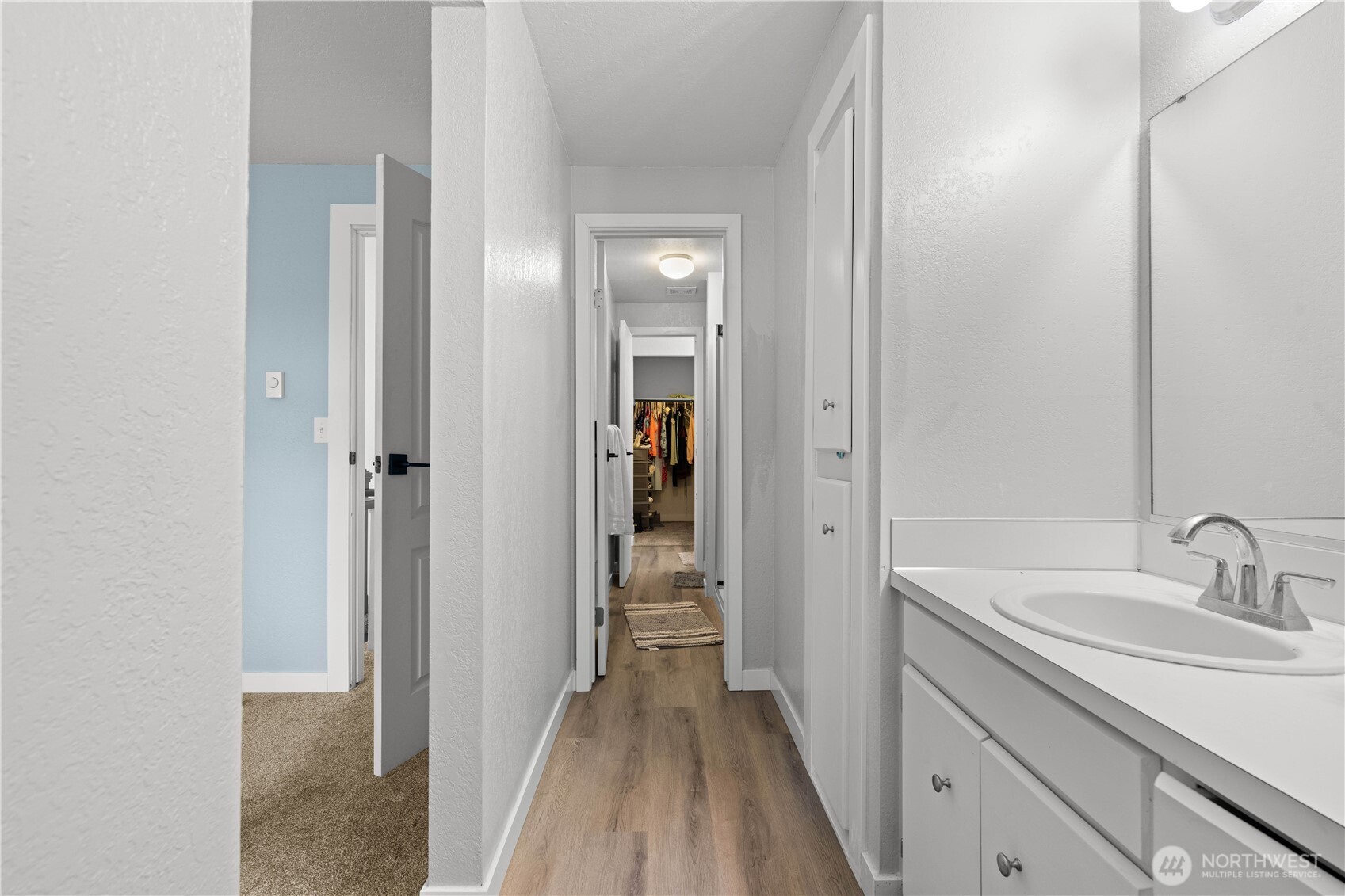 2621 Mountain View Avenue West, Unit 9B Tacoma, WA 98466 - Photo 18 of 30 a bathroom with a sink and a mirror