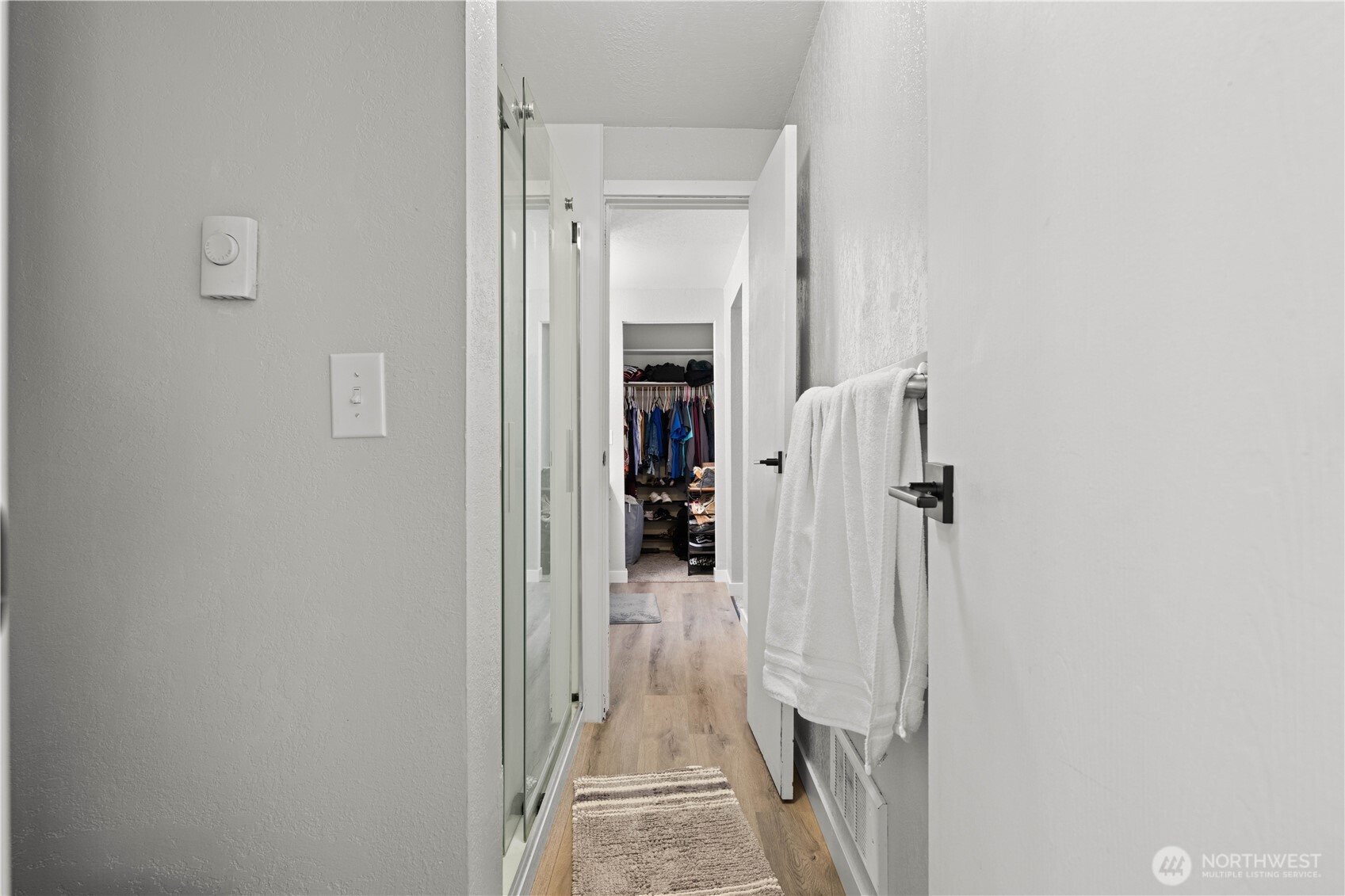 2621 Mountain View Avenue West, Unit 9B Tacoma, WA 98466 - Photo 19 of 30 a view of a hallway with wooden shelves