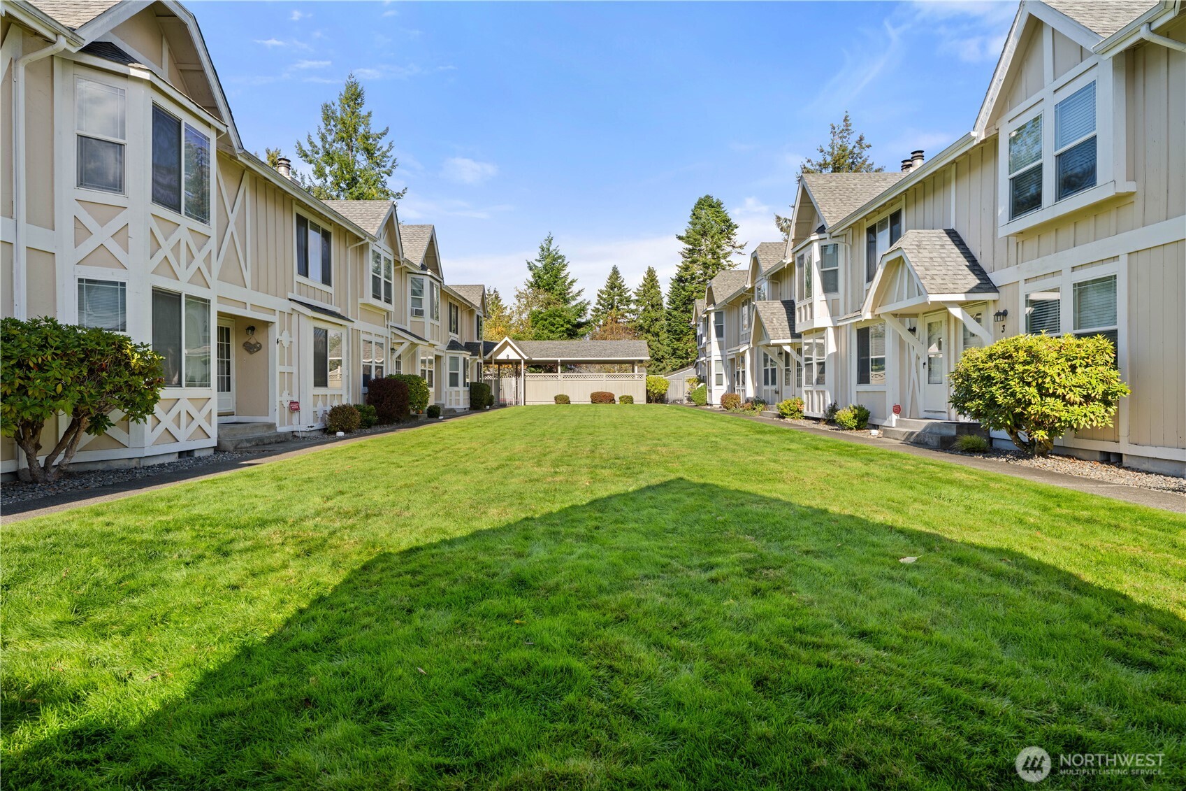2621 Mountain View Avenue West, Unit 9B Tacoma, WA 98466 - Photo 2 of 30 a view of a building with a yard