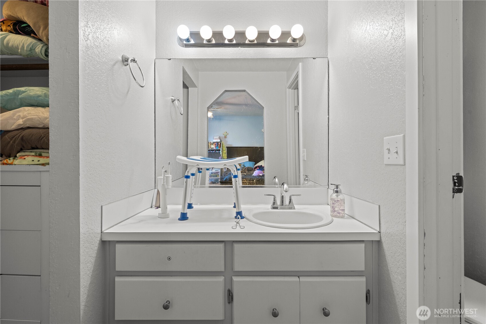 2621 Mountain View Avenue West, Unit 9B Tacoma, WA 98466 - Photo 21 of 30 a bathroom with a sink and a mirror