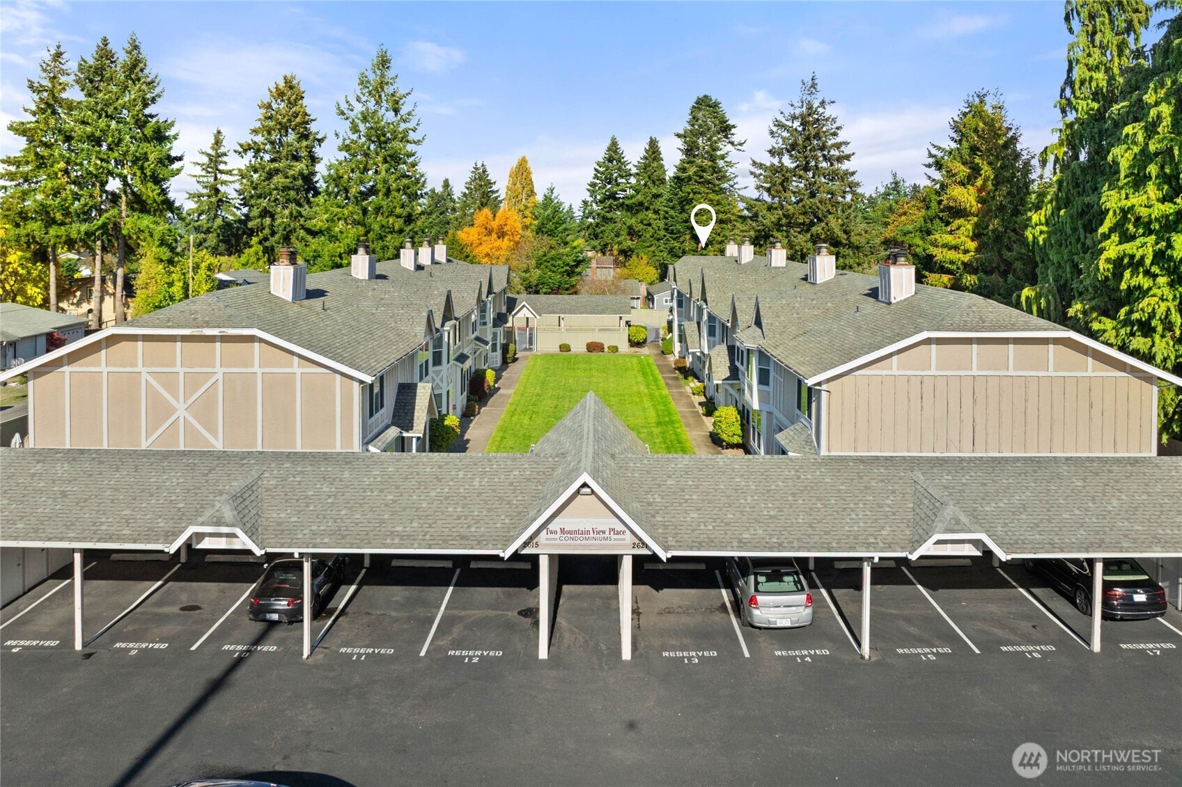 2621 Mountain View Avenue West, Unit 9B Tacoma, WA 98466 - Photo 28 of 30 an aerial view of a house with swimming pool and sitting area