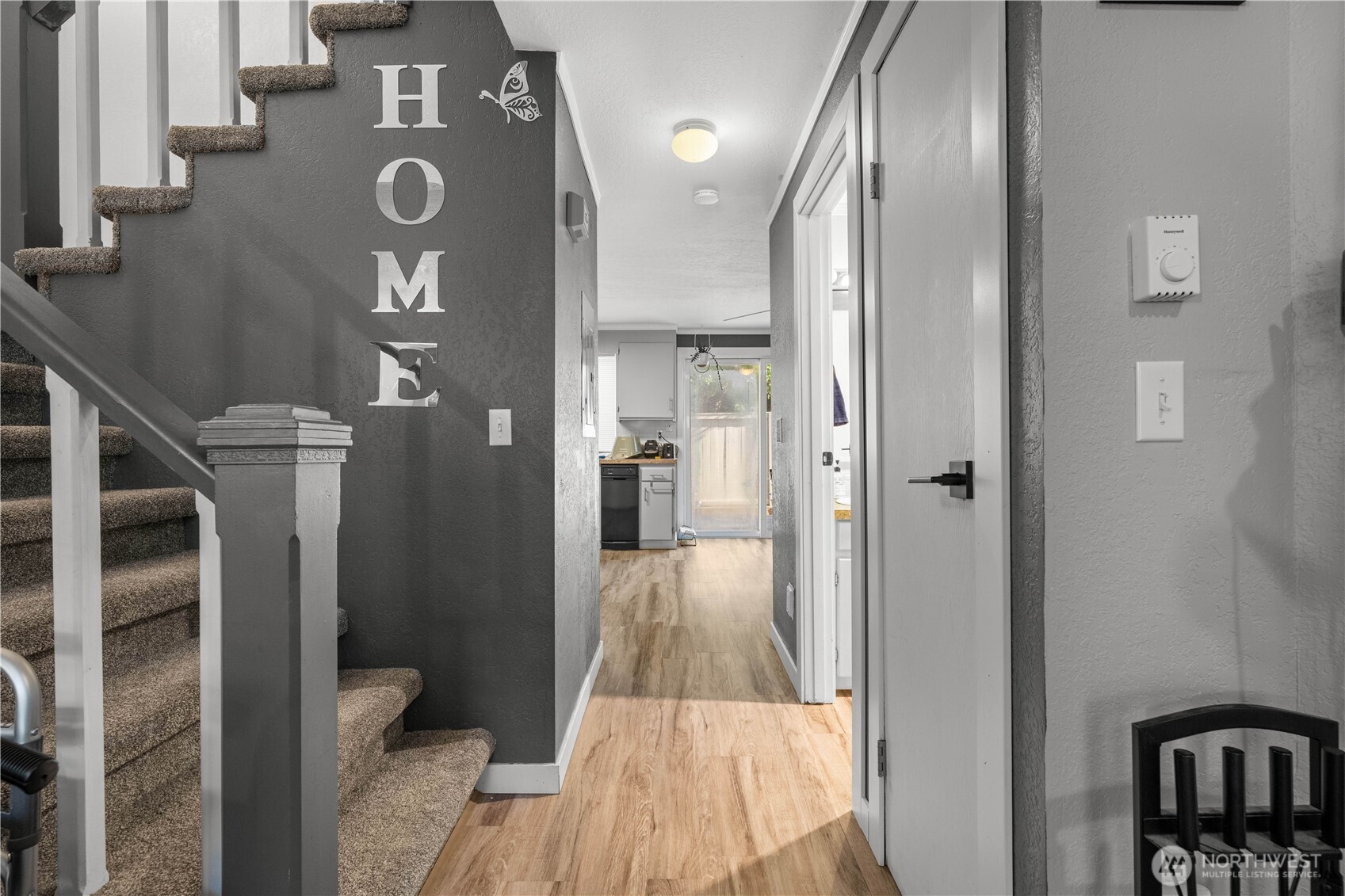 2621 Mountain View Avenue West, Unit 9B Tacoma, WA 98466 - Photo 5 of 30 a view of a livingroom with wooden floor and staircase