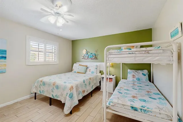 a bedroom with a bed and a table