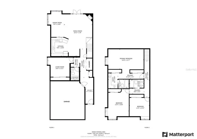 a large white kitchen with a large window and stainless steel appliances