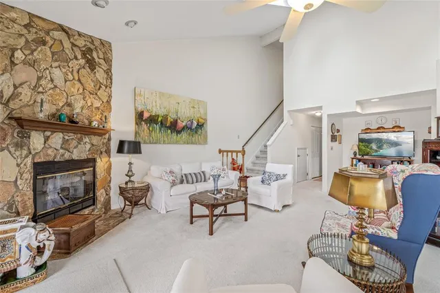 a white refrigerator freezer and a stove sitting inside of a kitchen