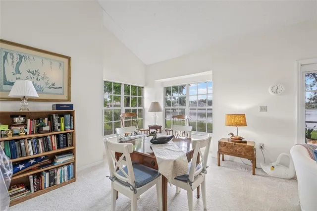 a kitchen with stainless steel appliances granite countertop a white cabinets and a stove top oven