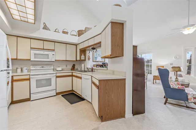 a kitchen with a sink and a refrigerator