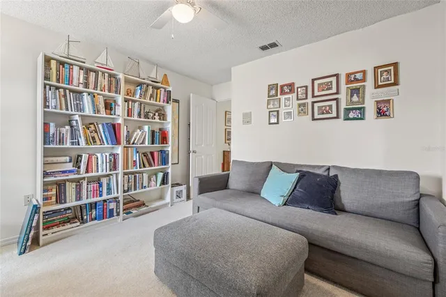 an empty room with furniture and windows