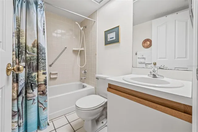 a bedroom with a bed cabinets and dresser