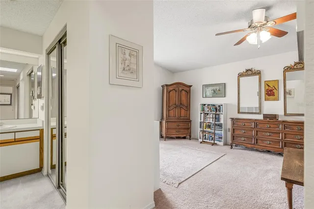 a large bathroom with a sink and a large mirror