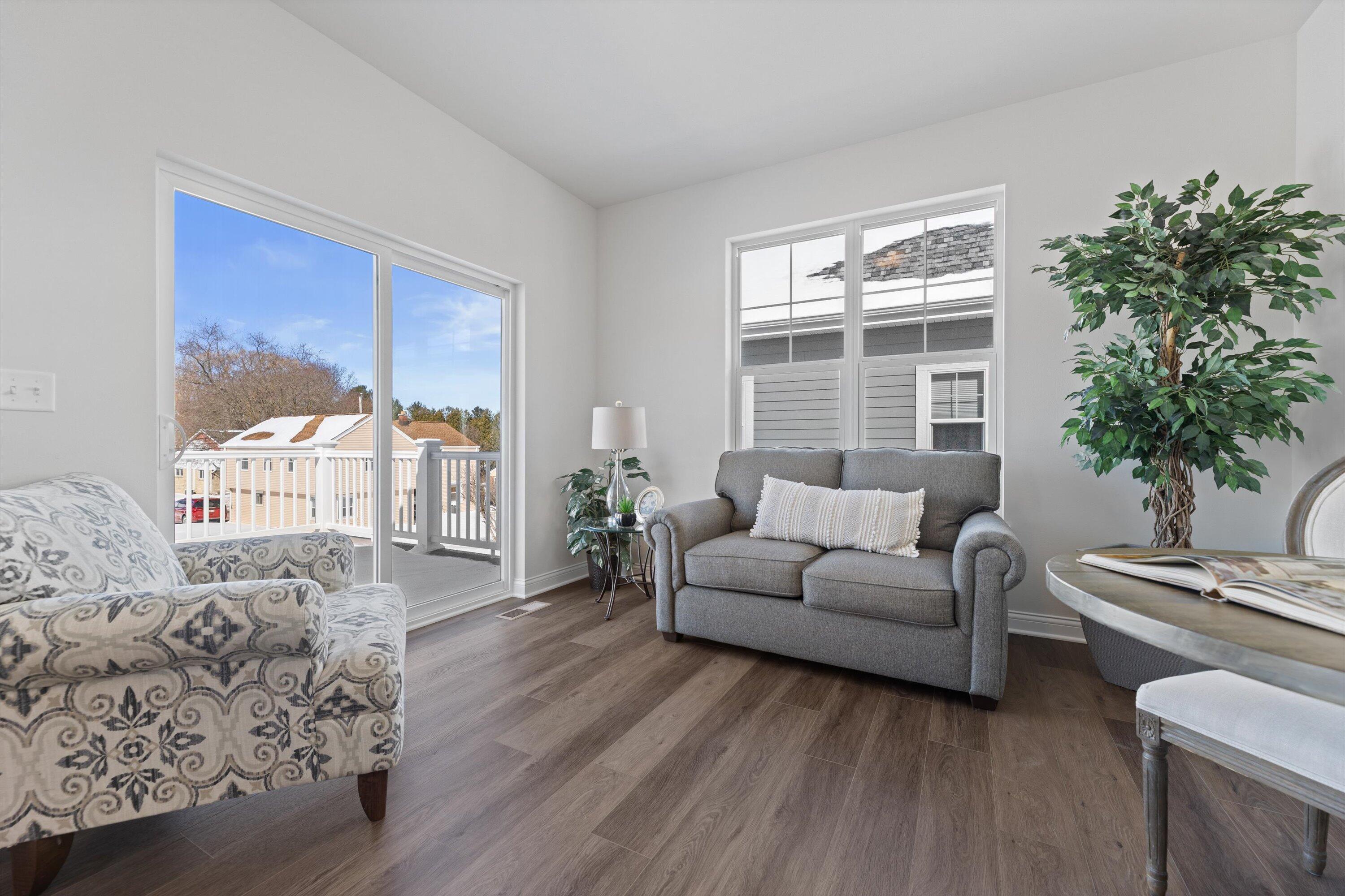 327 Sandy Circle Pewaukee, WI 53072 - Photo 22 of 40 Sunroom with Deck Access