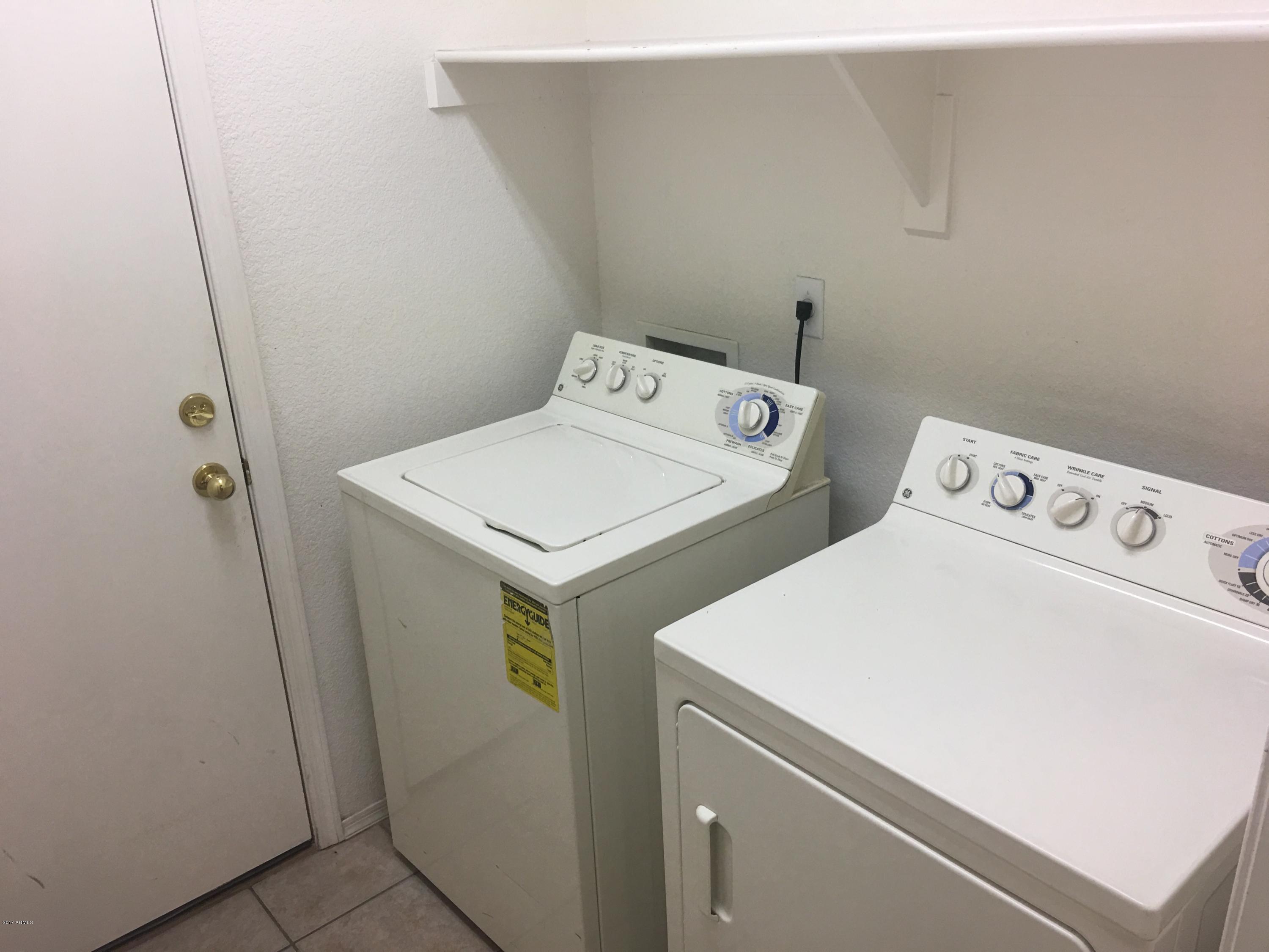 9128 West Berkeley Road Phoenix, AZ 85037 - Photo 6 of 17 a utility room with dryer and washer