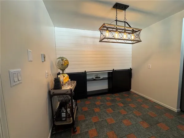 a room with a table and chairs
