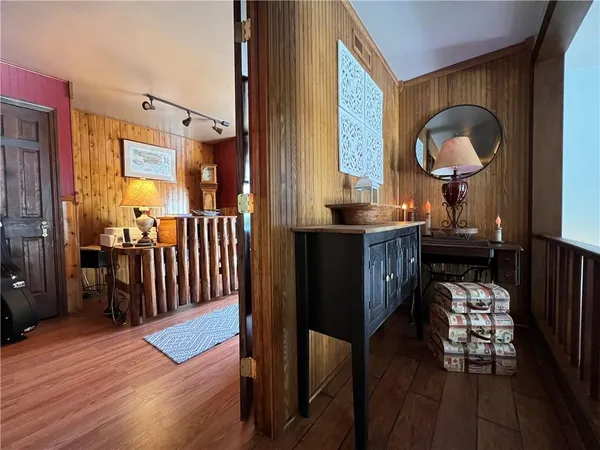 a view of a livingroom with furniture and entryway