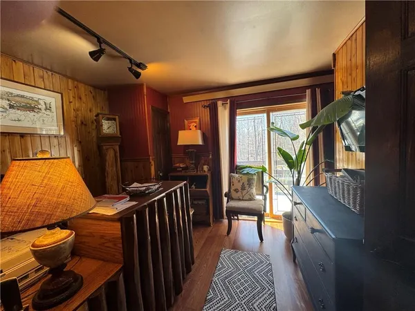 a reading room with furniture and a large window