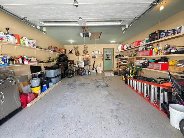 a view of a garage with a lot of stuff and toys