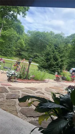 a view of a street with a yard