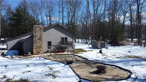 a view of a house with snow on the floor